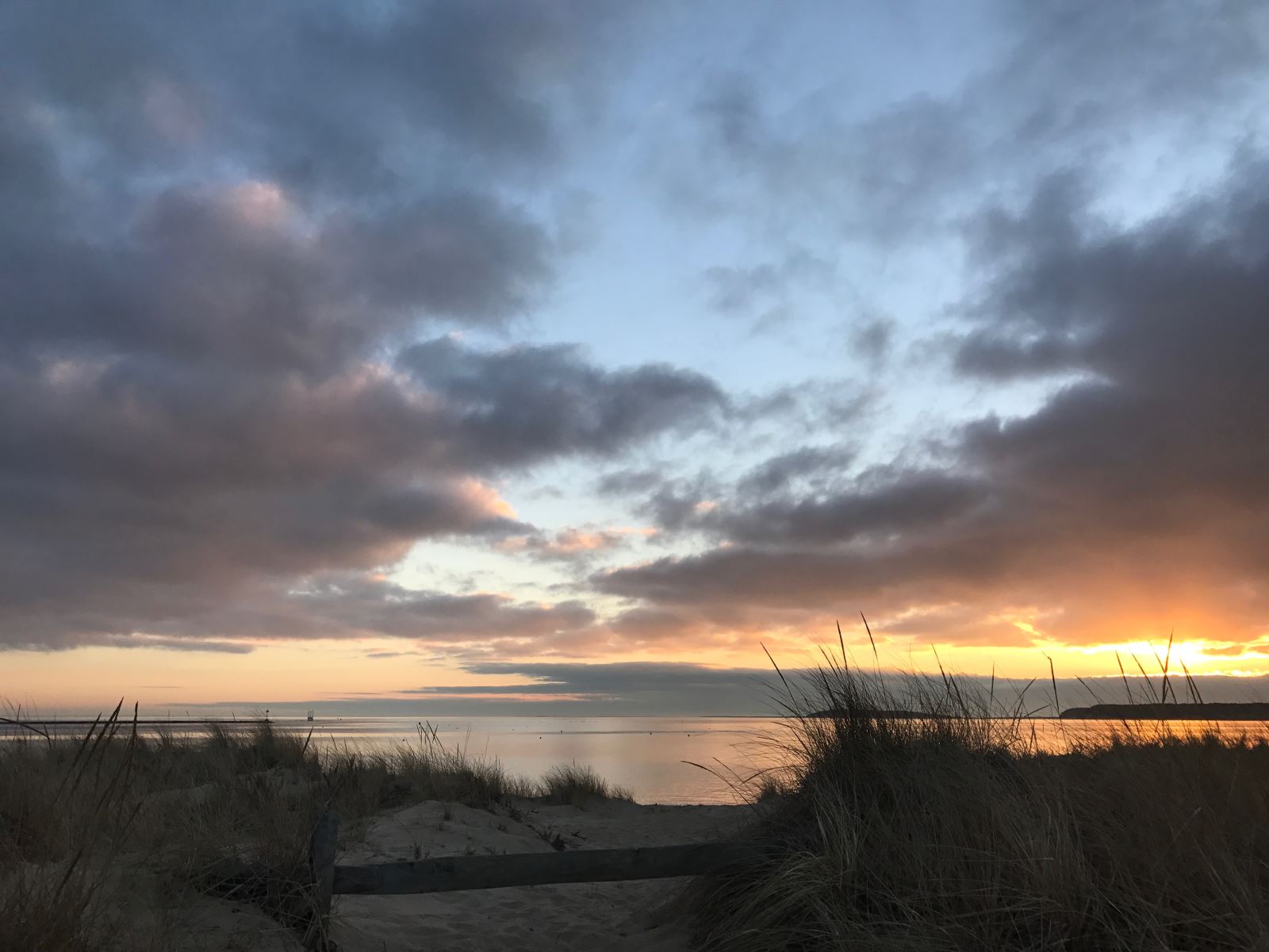 A beautiful sunset at Mayo Beach in Wellfleet, MA is the perfect way to end any day during your Cape Cod vacation with Nauset Rental