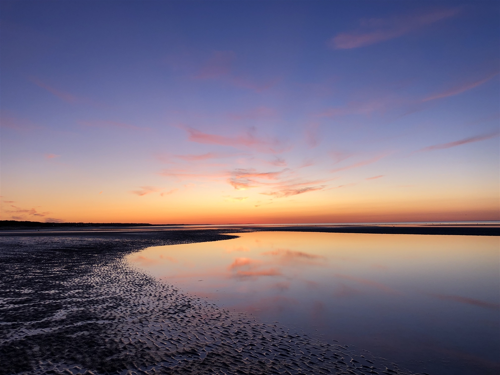 Cape Cod sunsets are like no other  hues of blue, yellow and orange over a Brewster Beach at sunset